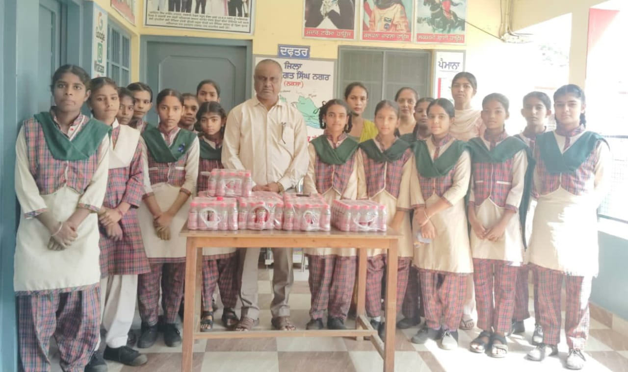 UK Trust distributed juice bottles to children.